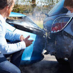 car is rear-ended, two men talking | car accident attorney