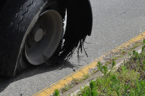 tire shredded on roadside | product liability attorney