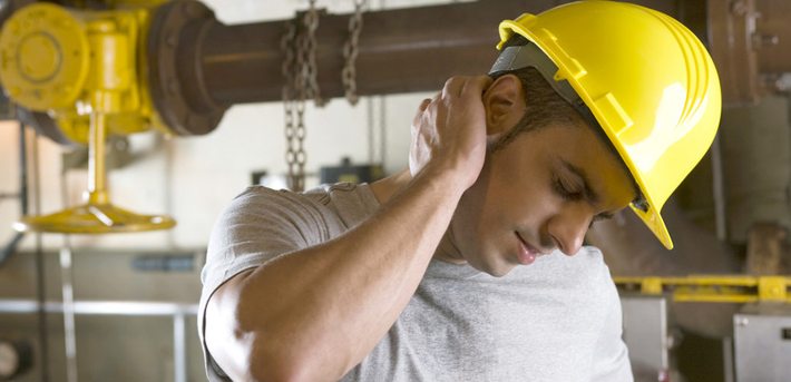construction worker holding neck | work injury attorney