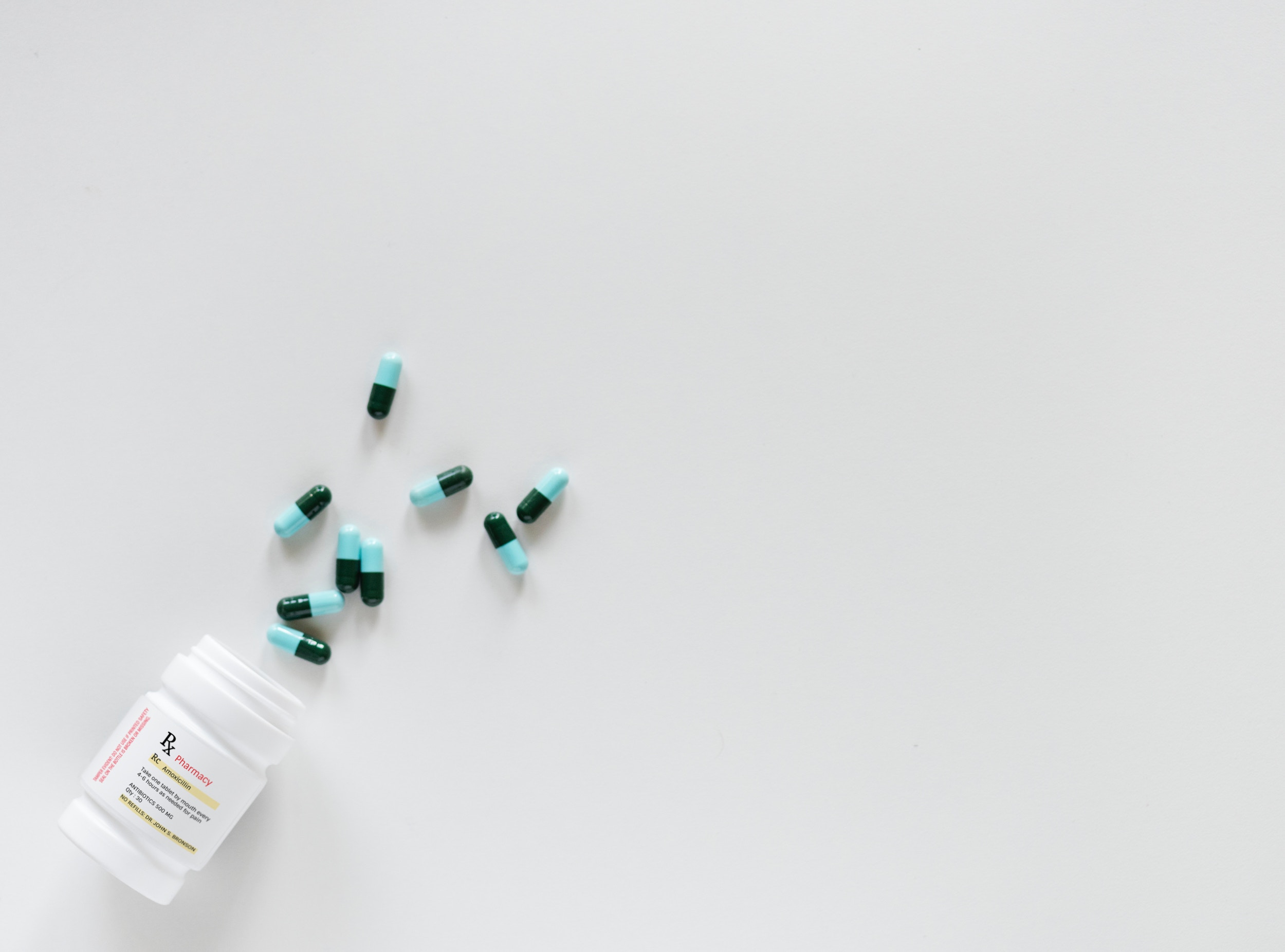 pills spilled out of bottle on table | product liability attorney