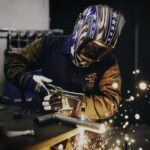 man welding | workers compensation attorney