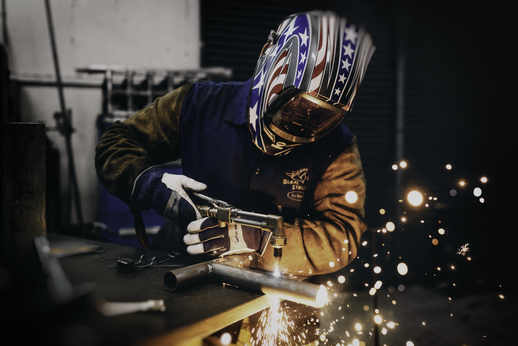man welding | workers compensation attorney