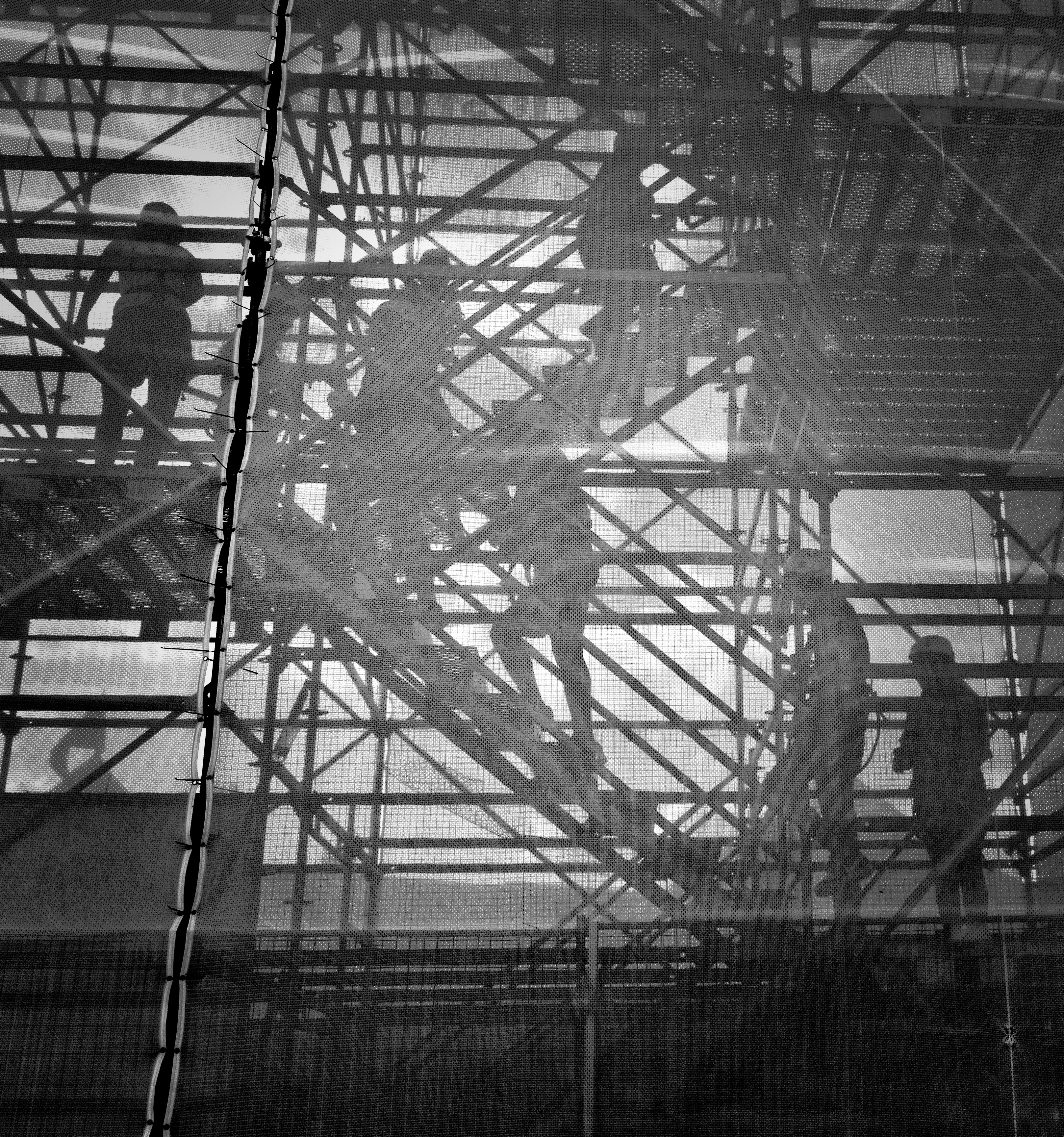 seven men on stairs at construction site | Work injury attorney