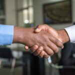 two men shaking hands | Mediation attorney