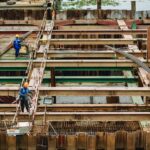 two construction workers working on site | work accident attorney