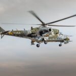 military helicopter flying in sky | product liability attorney