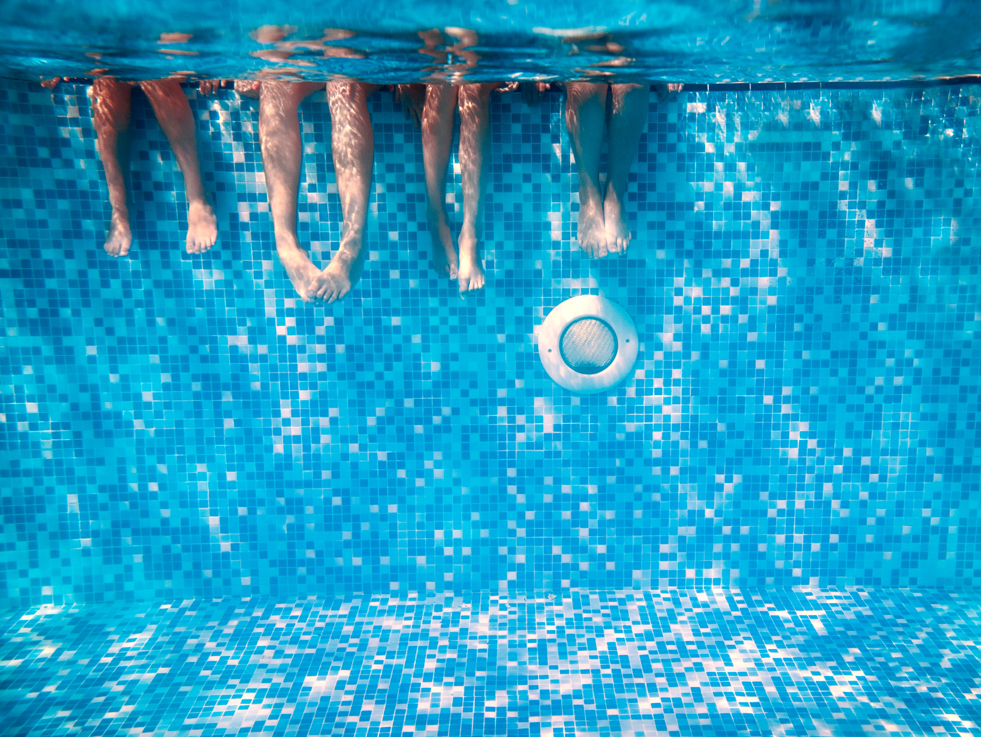 kids feet underwater in pool | premises liability attorney